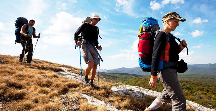 Hiker stepping down hill