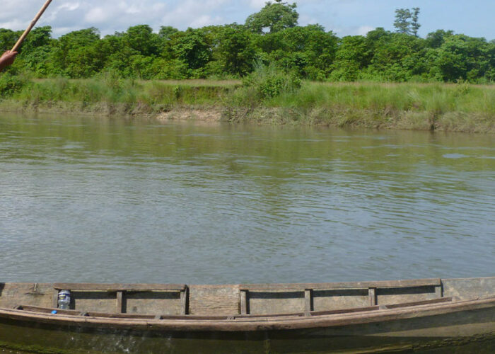 Man rowing a boat during Jungle Safari in Nepal