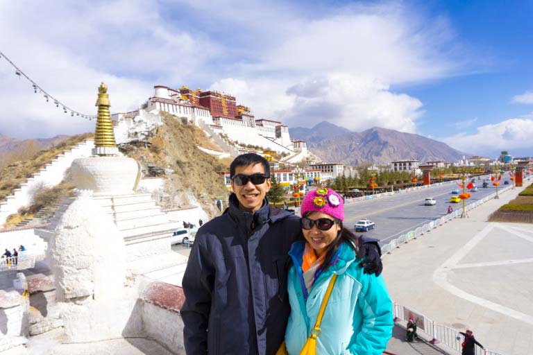 Taking picture infront of Potala Palace the winter palace of Dalai Lama