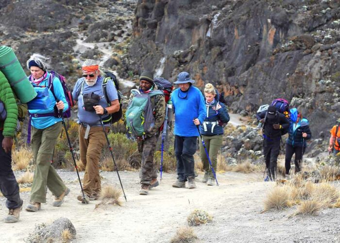 Tourist climbing the best route to hike Mount Kilimanjaro