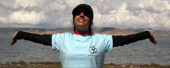Nisha standing in front of Manasarovar Lake