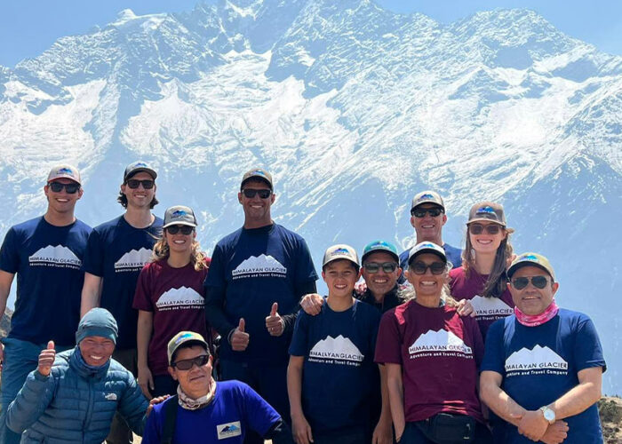 Happy travelers posing for the photos in a refreshed mood; Group on the way to Everest Base Camp with right cost to reach EBC prepared by Himalayan Glacier
