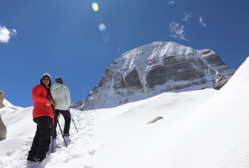 Circling the base of the mountain, known as Kailash circumambulation or Kora