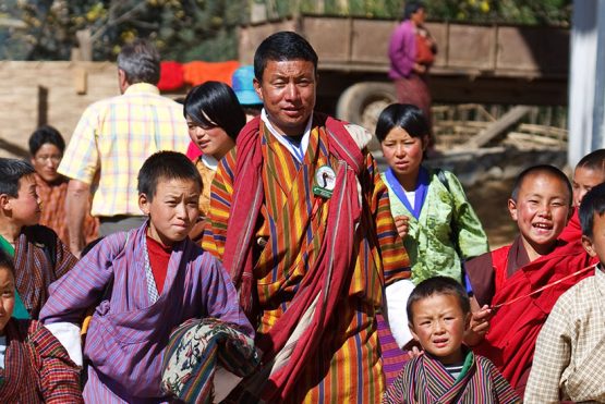 Bhutan’s Sustainable Tourism: How to Travel Responsibly Bhutanese in national dress